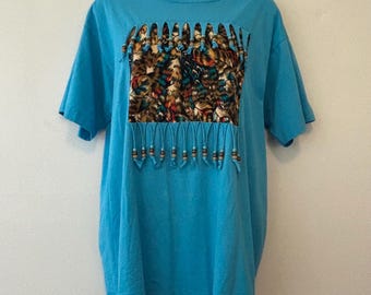 Turquoise T shirt with feather and bead trim