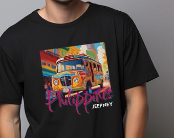 May include: A black t-shirt with a colorful graphic of a jeepney, a type of public transportation in the Philippines. The graphic includes the text "Philippines Jeepney".