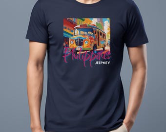 May include: A navy blue t-shirt with a colorful illustration of a jeepney, a type of public transportation in the Philippines, with the word "Philippines" written in pink script and "Jeepney" written in white below the illustration.