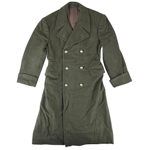 May include: An olive green double-breasted coat with gold buttons. The long coat features notched lapels, two front pockets, and cuffed sleeves. The fabric has a soft, textured appearance. The coat's length is approximately 130 cm.