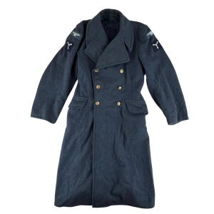 May include: A dark blue double-breasted coat with gold buttons, two front pockets, and shoulder patches. The coat has a wide collar and long sleeves. The coat is made of a wool-like material.