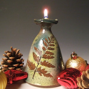 clay oil lamp with leaf impressions image 1