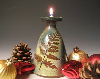 clay oil lamp with leaf impressions