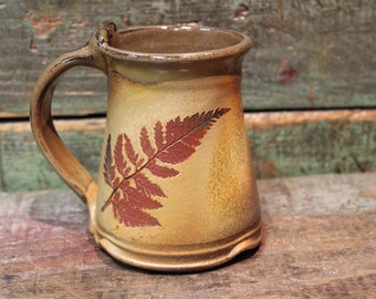 wheelthrown 12 ounce stoneware coffee mug, tea mug with leaf impressions