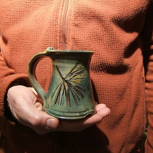 ceramic coffee mug in &quot;Green Leaf Glaze&quot; with white pine