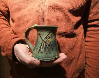 ceramic coffee mug in "Green Leaf Glaze" with white pine