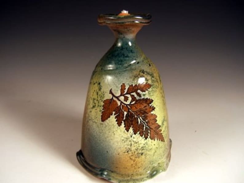 clay oil lamp with leaf impressions image 4