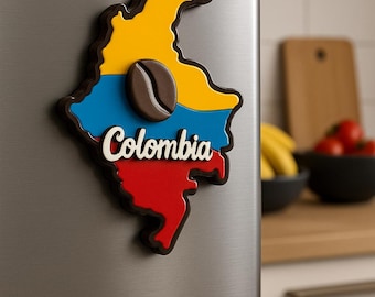 Imán para nevera con mapa de Colombia e íconos culturales: café, chiva, loro y símbolos.
