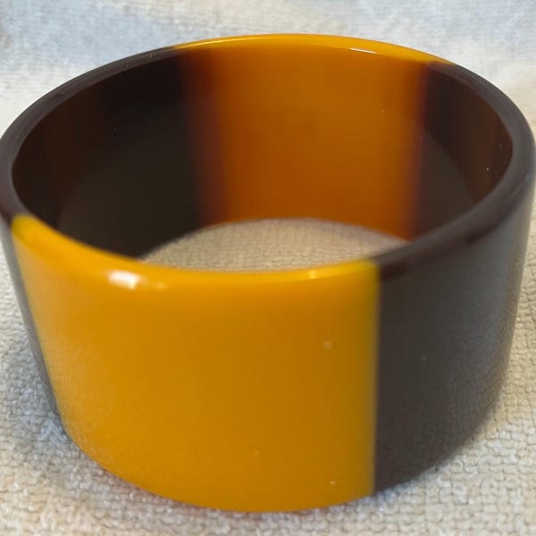 Brown and yellow plastic bangle