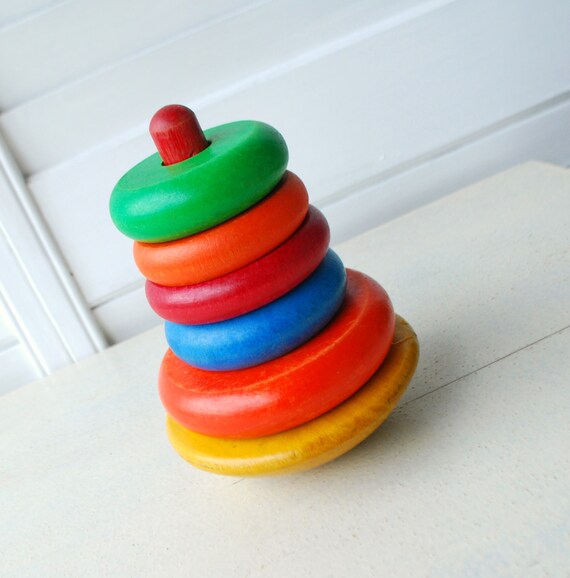 Items similar to Vintage wooden stacking toy, rings, colorful, wobble