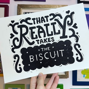 That takes the biscuit linocut print Black on White