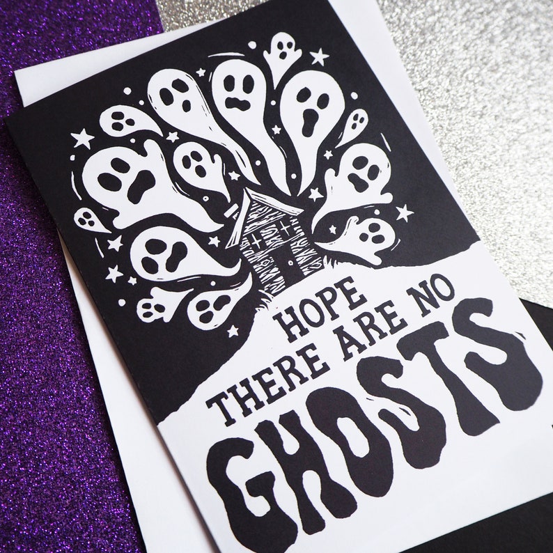 May include: Black and white illustration of a haunted house with ghosts flying out of the windows. The text "Hope there are no ghosts" is written below the house.