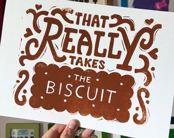 That takes the biscuit linocut print