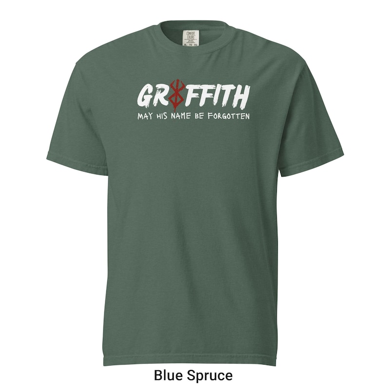 May include: A green t-shirt with a white graphic that says "Griffith" with a red and white symbol above the text. The text below the graphic says "May his name be forgotten".