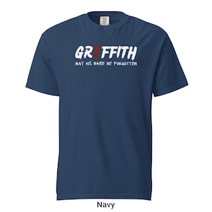 May include: Navy blue t-shirt with white text that reads "Griffith May His Name Be Forgotten" and a red hand symbol.