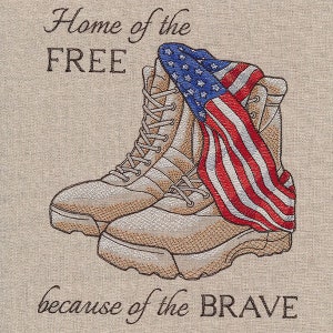 May include: Embroidered design featuring a pair of tan military boots with an American flag draped over them. The text "Home of the FREE because of the BRAVE" is stitched below the boots.
