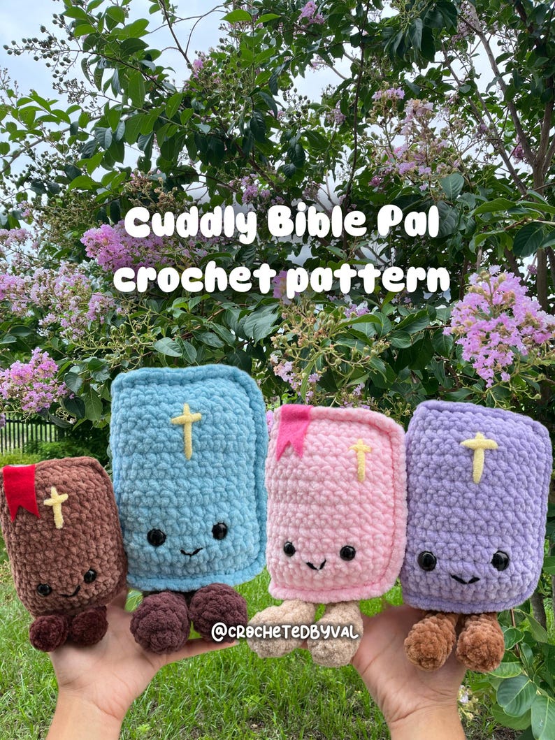 May include: Four plush crochet Bible toys in brown, light blue, light pink, and light purple. Each rectangular toy features a yellow cross, black safety eyes, a stitched smile, and a small colored bookmark. Text reads Cuddly Bible Pal crochet pattern.