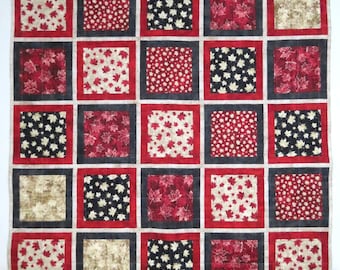 Édredon ou jeté sur les genoux du patrimoine canadien, rouge noir beige, drapeaux et symboles du Canada