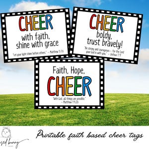 May include: Three printable cheer tags with a film strip border. The tags feature the word "CHEER" in rainbow colors with inspirational messages and bible verses. The first tag says "CHEER with faith, shine with grace" and includes the verse "Let your light shine before others." - Matthew 5:16. The second tag says "CHEER boldly, trust bravely!" and includes the verse "Be strong and courageous... for the Lord your God is with you." - Joshua 1:9. The third tag says "Faith, Hope, CHEER" and includes the verse "With God, all things are possible." - Matthew 19:26.