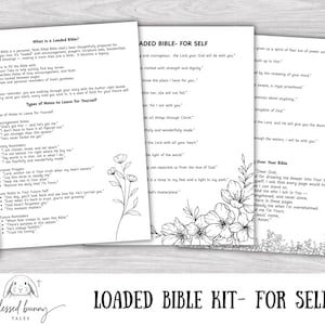 May include: A Loaded Bible Kit for Self, featuring three white pages with printed text and floral illustrations. A gold pen rests on the side. The kit includes notes and prayers. The words "Loaded Bible Kit - For Self" are printed at the bottom.