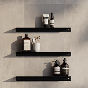 Estante de baño de acero: moderno organizador de ducha impermeable de pared. Almacenamiento flotante en blanco y negro para una decoración minimalista.