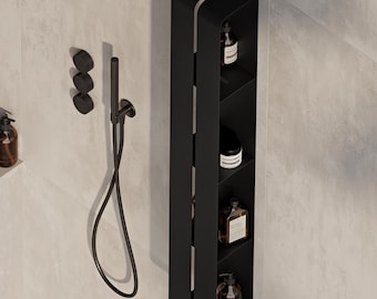 May include: A matte black vertical shower storage unit with four open shelves containing various amber and clear bottles. Beside the unit is a matching matte black handheld shower head on a flexible hose and three circular control knobs.