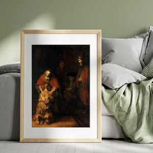 May include: Framed print of a classic painting depicting a biblical scene. The artwork features figures in rich red and brown robes, with a focus on a central embrace. The style is reminiscent of old masters, with dramatic lighting and detailed brushwork.