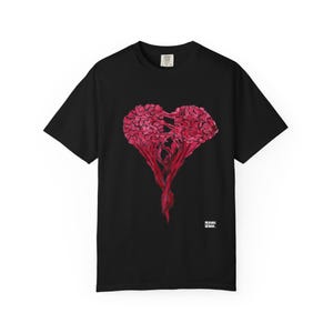 May include: Black t-shirt featuring a red heart-shaped design. The graphic appears to be a stylized representation of a brain or a similar organic form. The shirt has a classic crew neck and short sleeves.