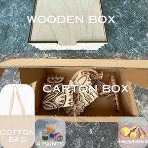 May include: A wooden box with the text "WOODEN BOX" is above a cardboard box labelled "CARTON BOX." Inside the carton are wooden cutouts. Below are a cotton bag, four paint pots, and four sponges.