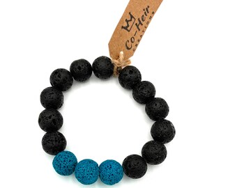 Bracciale elastico con perline di lava nere e verde acqua