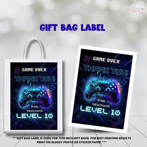 May include: White gift bag and card featuring a neon blue and purple video game controller design. The text reads "Game Over, Thank You! For Reaching Level 10". The design is set against a circuit board background.