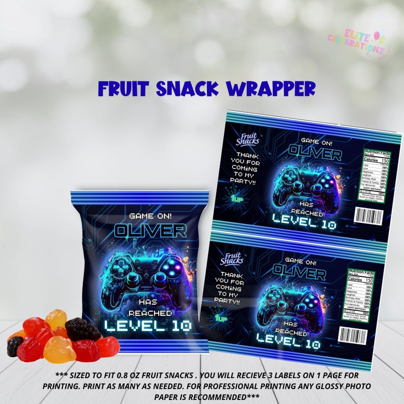May include: A fruit snack wrapper with a video game theme. The design features a blue and black color scheme with a game controller graphic and the text "GAME ON! OLIVER HAS REACHED LEVEL 10". The wrapper is designed to fit 0.8 oz fruit snacks.