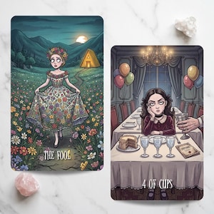 May include: Two rectangular tarot cards featuring illustrated scenes. The left card, labeled THE FOOL, shows a person in a floral dress walking through a meadow. The right card, labeled 4 OF CUPS, depicts a person sitting at a table with a cake.