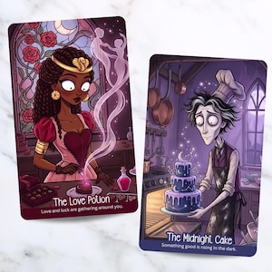 May include: Two rectangular tarot-style cards with illustrations. The left card, titled The Love Potion, shows a person with dark hair and a gold headpiece adding a glowing pink liquid to a heart-shaped treat. The right card, titled The Midnight Cake, shows a person in a chef hat holding a three-tiered blue cake with moon and star designs.