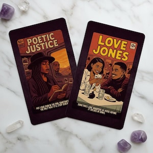 May include: Two rectangular cards with comic book-style illustrations. One features a woman writing with text "POETIC JUSTICE" and "PUT YOUR PAIN IN THE PEN..." The other shows a couple with text "LOVE JONES" and "SOMETIMES LOVE WHISPERS..."