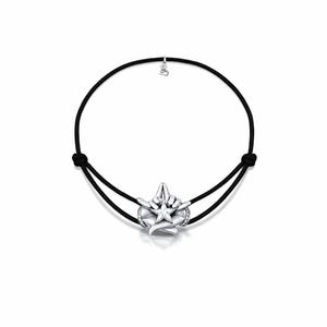 May include: A silver bracelet with a black cord. The bracelet features a detailed star-shaped pendant with a central clear stone and surrounding small crystals. A small charm hangs from the cord above the pendant.