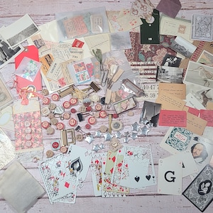 May include: A collection of vintage ephemera, including cards, paper, and ephemera, with a variety of colors and patterns. The collection includes a variety of numbers, playing cards, and a vintage postcard with a bird.