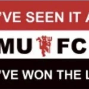 May include: A rectangular sticker with a red, white, and black color scheme. The top section reads "WE'VE SEEN IT ALL" in white text on a red background. The middle section displays "MU FC" with a red devil logo on a white background. The bottom section reads "WE'VE WON THE LOT" in white text on a black background.