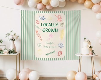 Baner na baby shower na targu rolniczym, dekoracje na baby shower z lokalnie uprawianych produktów, tabliczka z napisem „Doodle Baby Shower”, dekoracja tła na imprezę z motywem warzyw