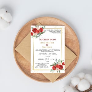 May include: Wedding invitation with a floral design featuring red and white flowers. The invitation is for Sebastian and Samira's wedding on August 18th at 4 PM. The text on the invitation reads "Nuestra Boda" which means "Our Wedding" in Spanish.