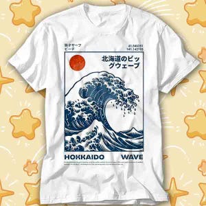 May include: White t-shirt with a graphic of a blue wave and a red sun, with Japanese text. The design includes the words "HOKKAIDO WAVE" in a rectangular frame. Coordinates are also printed on the shirt.