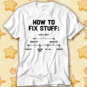 May include: White t-shirt featuring the text "HOW TO FIX STUFF:" in black, with a flowchart below. The flowchart poses the question "DOES IT MOVE?" and suggests solutions like "GAFFER TAPE" and "OIL-40".