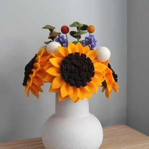 Felt Flower Bouquet including 4 sunflower stems, 3 lavender stems, 3 eucalyptus stems, 4 medium felt balls, and 3 small felt balls