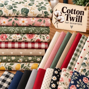 May include: A collection of cotton twill fabric fat quarters featuring various patterns including floral prints, red and white gingham, small hearts, polka dots, and lemon motifs. A beige tag with the text Cotton Twill FAT QUARTERS is included.