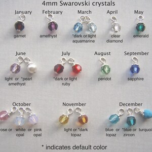 May include: A collection of 4mm Swarovski crystal charms, each representing a month of the year. The charms feature various colors, including garnet, amethyst, emerald, sapphire, and topaz. Text indicates the month and crystal name. The text also indicates the default color.