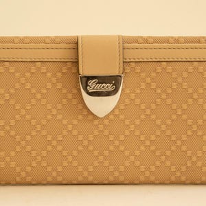 Cartera continental Gucci en color beige en perfecto estado vintage