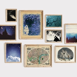 May include: A gallery wall with nine framed prints, including a map, a cityscape, a starry night sky, a silhouette of a castle, a girl looking at a tree, a silhouette of a couple, a forest, a mountain range, and a hand reaching for stars.