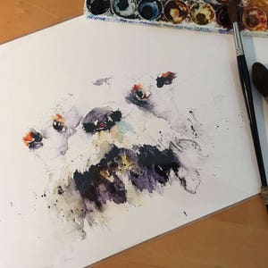 May include: Watercolour painting of a white dog's face with black and purple accents. The dog's eyes are open and the mouth is slightly open.