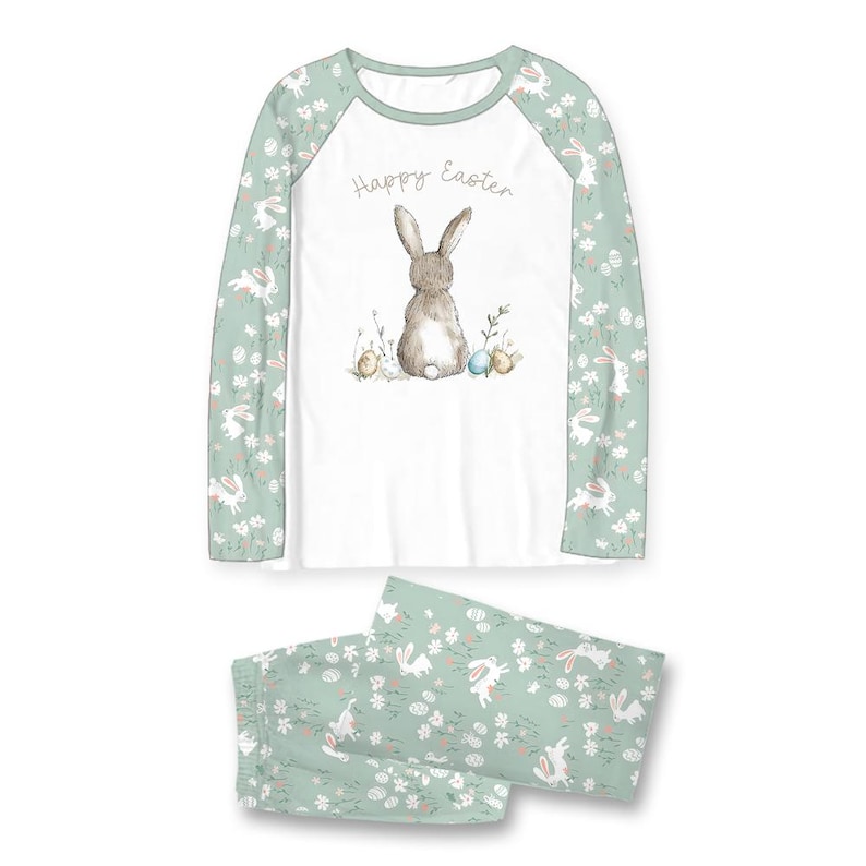 Pode incluir: Conjunto de pijama de P&aacute;scoa branco e verde menta. A parte superior de manga comprida apresenta uma ilustra&ccedil;&atilde;o de um coelho com o texto "Happy Easter". As mangas e as cal&ccedil;as do pijama s&atilde;o estampadas com coelhos e flores.
