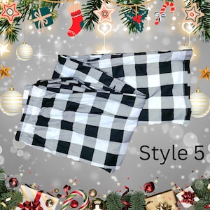 May include: A black and white buffalo check pattern textile, labeled "Style 5". The fabric is folded and displayed against a festive holiday background with ornaments and garland.